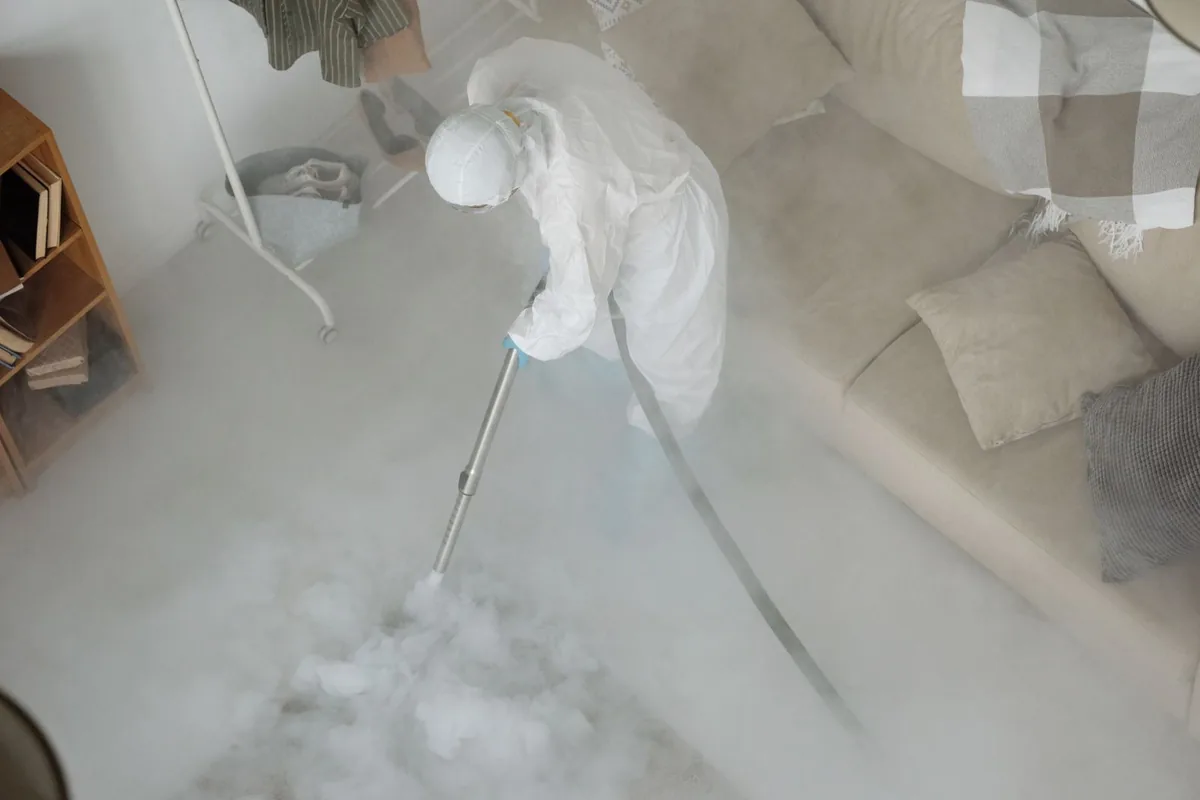 Biohazard cleanup technician in protective equipment, Lake Marcel-Stillwater, WA